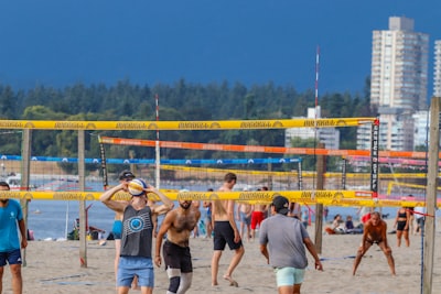 Play beach volleyball