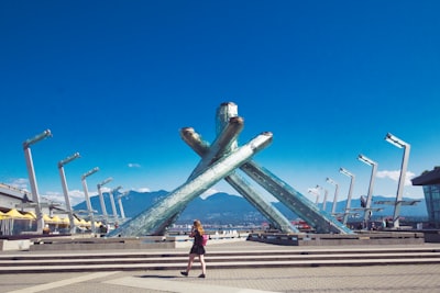 Photograph the iconic sail-shaped roof and Olympic Cauldron